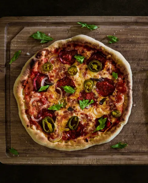 Pizza on a wooden cutting board